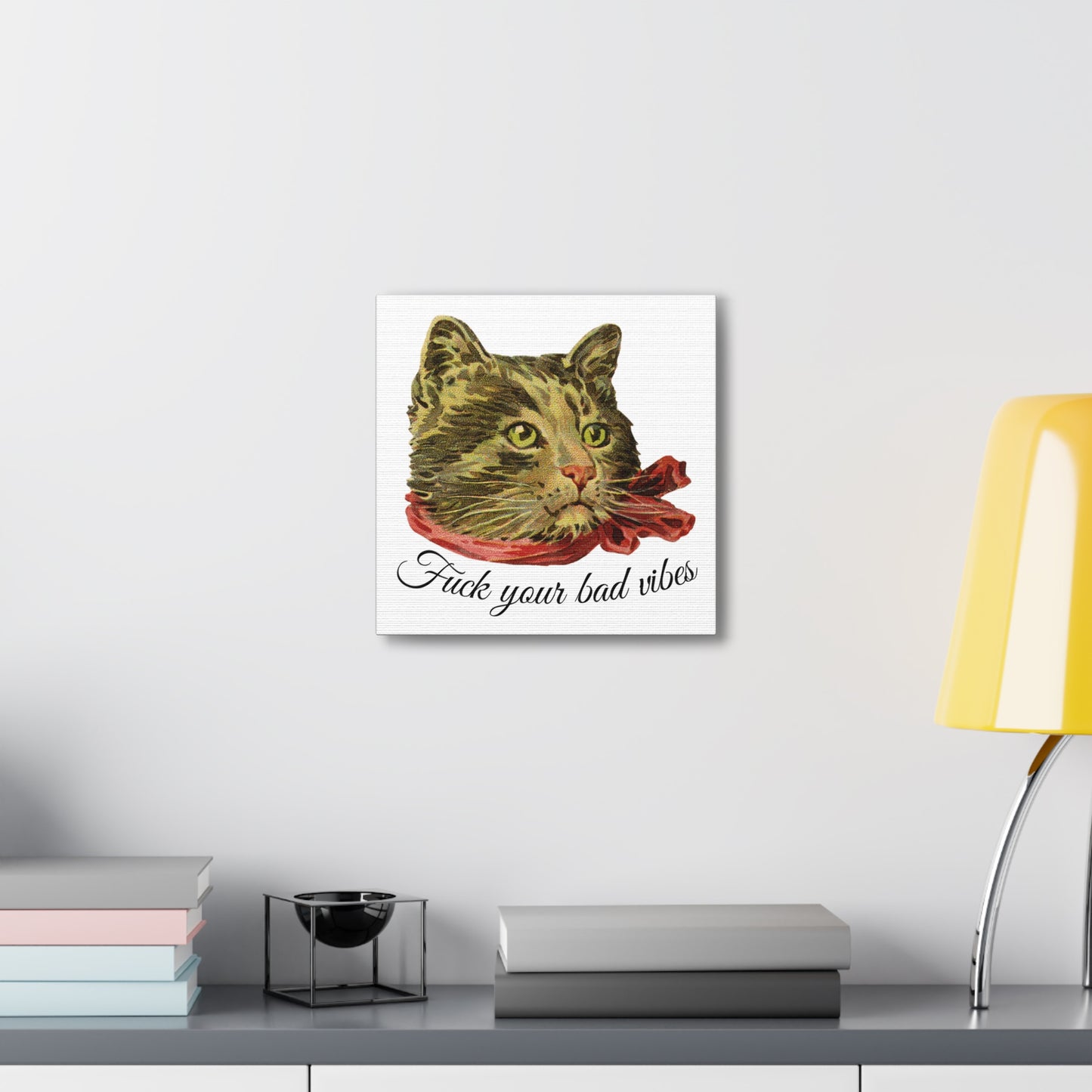 canvas wrap featuring the phrase "Fuck Your Bad Vibes" in elegant cursive beneath a charming vintage graphic of a stylish cat sporting a scarf mounted on wall.