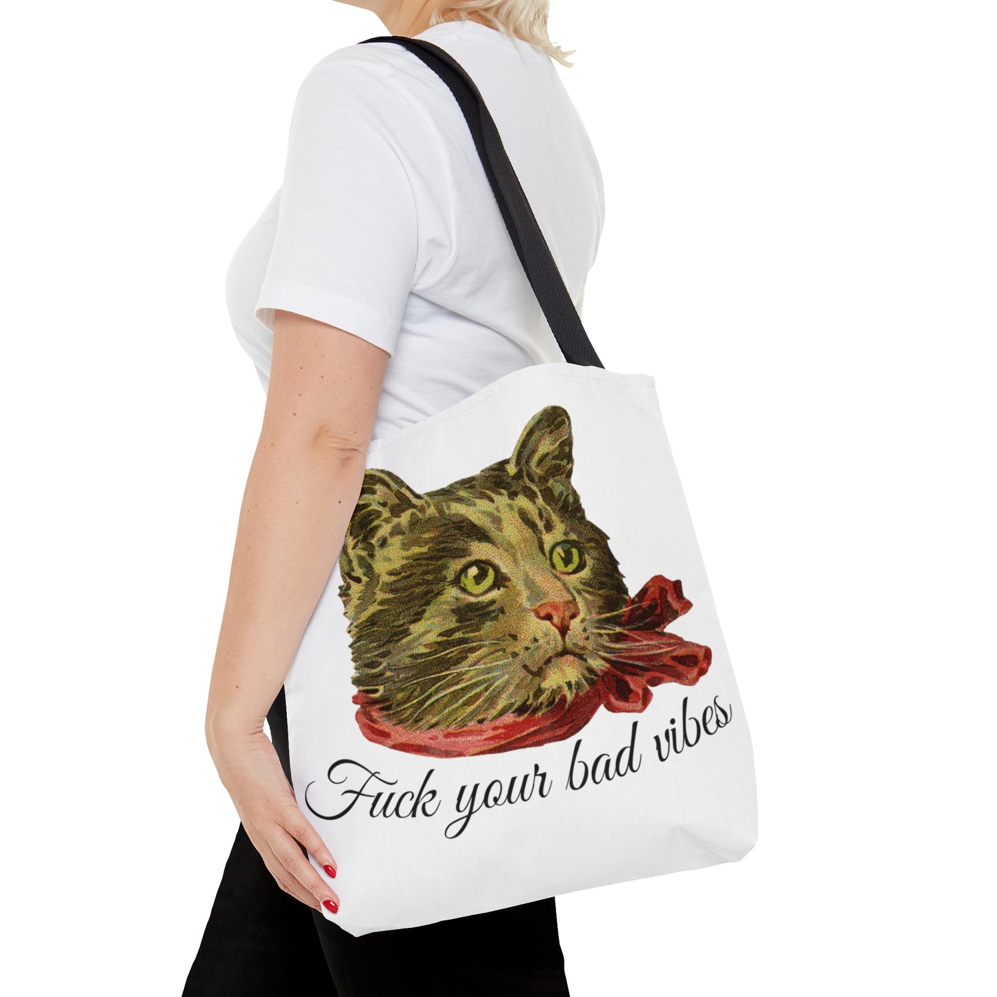 woman with tote bag featuring the phrase "Fuck Your Bad Vibes" in elegant cursive beneath a charming vintage graphic of a stylish cat sporting a scarf